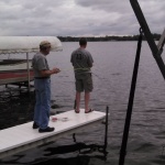 Tim fishes, Dad waits his turn. There are other docks, eh?